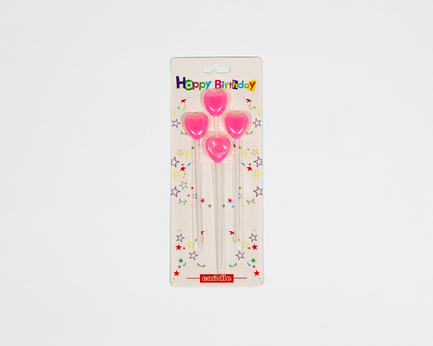 Pink heart candles charm the cake