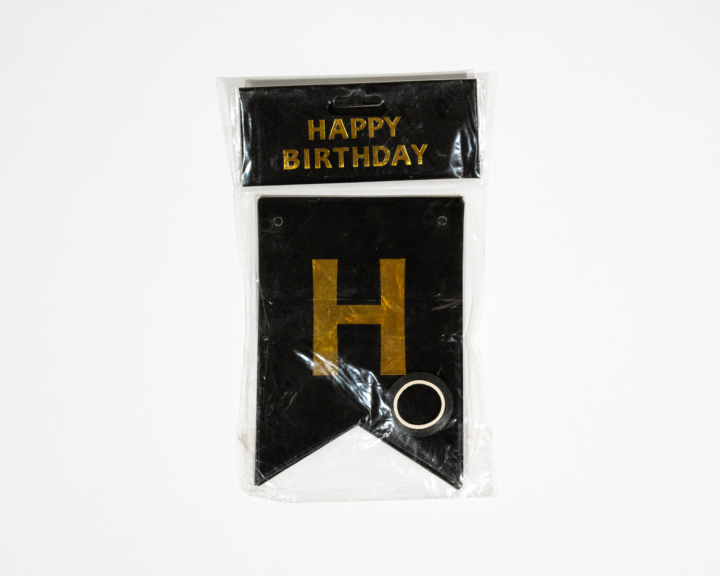 Happy Birthday banner decorates any space gold and black