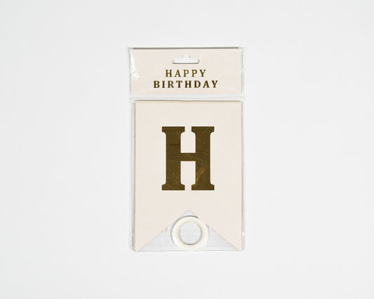 Happy Birthday banner decorates any space gold and white